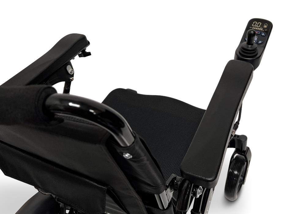 Close-up of a black ComfyGo MAJESTIC IQ-9000 Auto Folding Electric Wheelchair, showcasing its armrest and advanced digital joystick controller with a sleek display. The seat cushion enhances the design, while the brushless silent motors ensure a smooth ride against a plain black backdrop.