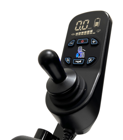Close-up of the ComfyGo MAJESTIC IQ-9000 Auto Reclining Electric Wheelchair’s black digital joystick controller, crafted from aircraft-grade aluminum alloy, with a speed and battery display, illuminated buttons, and a precision joystick.