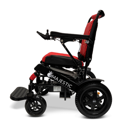A side view of the ComfyGo MAJESTIC IQ-9000 Auto Reclining Electric Wheelchair in black and red, built from aircraft-grade aluminum alloy, with a padded seat, footrest, armrests, large rear wheels, and “Majestic” on the frame.