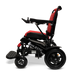 Side view of the ComfyGo MAJESTIC IQ-9000 Auto Folding Electric Wheelchair in red and black with a Majestic logo. It showcases large rear wheels, smaller front wheels, a cushioned seat, and foldable footrests for improved mobility and comfort. The wheelchair is powered by brushless silent motors and controlled via a digital joystick controller.