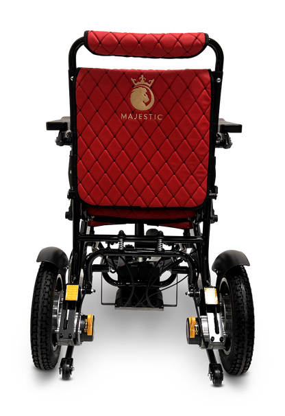 Rear view of a black ComfyGo MAJESTIC IQ-9000 Auto Reclining Electric Wheelchair with quilted red upholstery, gold Majestic logo on the backrest, large rear wheels, brushless silent motors, and sturdy armrests.