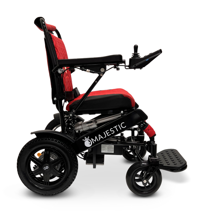 A side view of a black and red ComfyGo MAJESTIC IQ-9000 Auto Folding Electric Wheelchair showcases an IQ-9000 AR digital joystick controller on the right armrest, a cushioned seat, and footrests. Equipped with brushless silent motors, it has two large rear wheels and smaller front wheels for enhanced mobility.