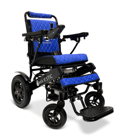 The ComfyGo MAJESTIC IQ-9000 Auto Reclining Electric Wheelchair features a black aircraft-grade aluminum alloy frame, large rear wheels, blue quilted cushions, digital joystick armrest controls, and an adjustable footrest with the Majestic logo.