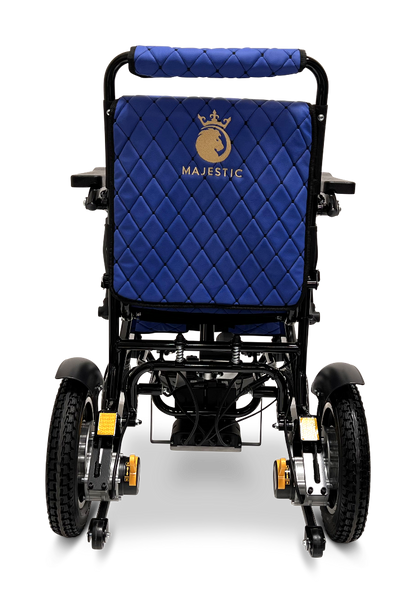 Rear view of a blue ComfyGo MAJESTIC IQ-9000 Auto Reclining Electric Wheelchair with quilted stitching, gold logo on the backrest, large rubber wheels, visible footrests and armrests, made from aircraft-grade aluminum alloy.