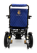 Rear view of a ComfyGo MAJESTIC IQ-9000 Auto Folding Electric Wheelchair, showcasing a quilted blue backrest adorned with a gold crown logo. This model features brushless silent motors and large rear wheels, with expertly designed mechanical components for optimal performance.