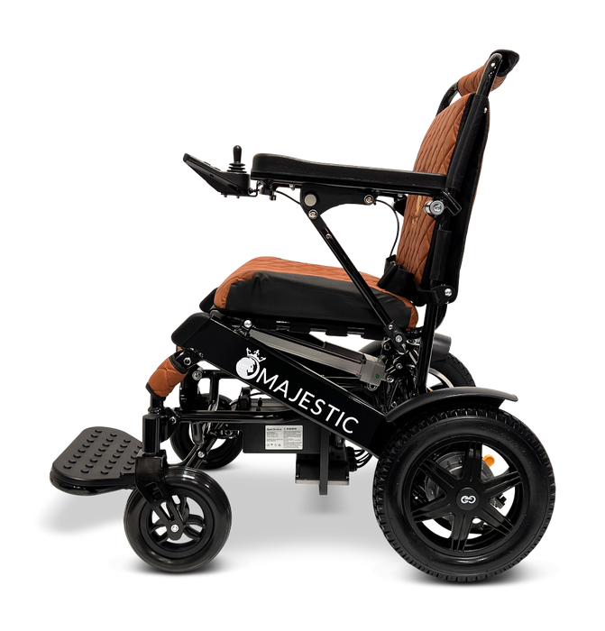 A side view of the stylish ComfyGo MAJESTIC IQ-9000 Auto Folding Electric Wheelchair showcases a black frame paired with a brown cushioned seat and backrest. The Majestic model is equipped with large rear wheels, smaller front wheels, and brushless silent motors, all controlled via a digital joystick for smooth maneuverability.