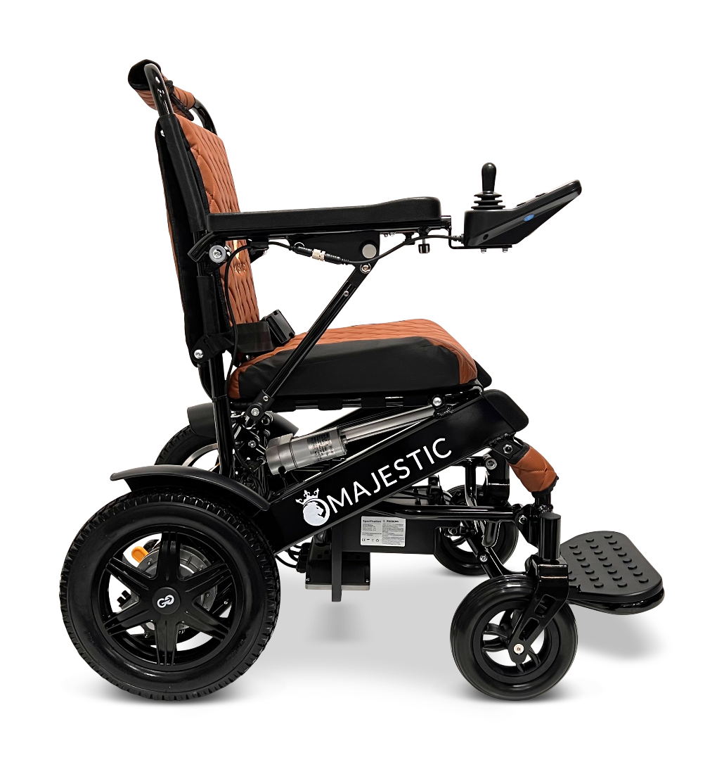 Side view of a black and brown ComfyGo MAJESTIC IQ-9000 Auto Reclining Electric Wheelchair with a digital joystick controller, padded seat and backrest, large rear wheels with brushless silent motors, and an aluminum alloy frame.