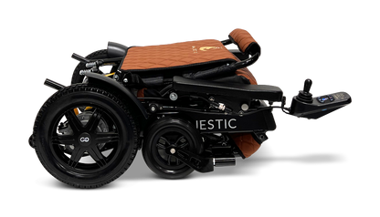 Introducing the ComfyGo MAJESTIC IQ-9000 Auto Folding Electric Wheelchair in a neatly folded design with a brown and black finish. It features the advanced IQ-9000 AR digital joystick controller and large rear wheels, powered by brushless silent motors for smooth operation. This compact wheelchair is perfect for easy transport and storage.