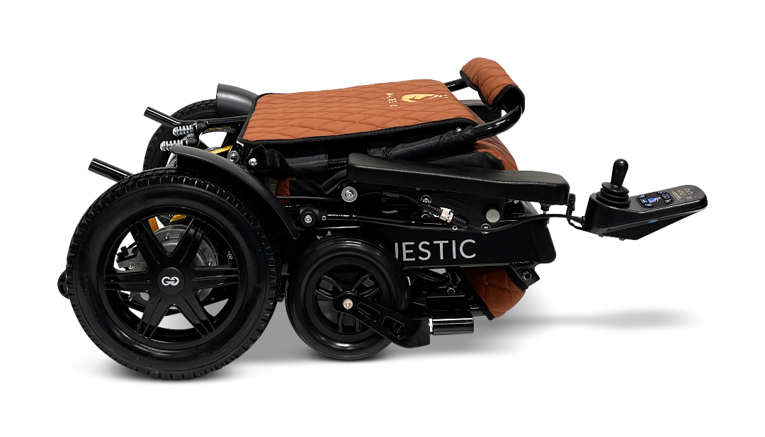 Introducing the ComfyGo MAJESTIC IQ-9000 Auto Folding Electric Wheelchair in a neatly folded design with a brown and black finish. It features the advanced IQ-9000 AR digital joystick controller and large rear wheels, powered by brushless silent motors for smooth operation. This compact wheelchair is perfect for easy transport and storage.