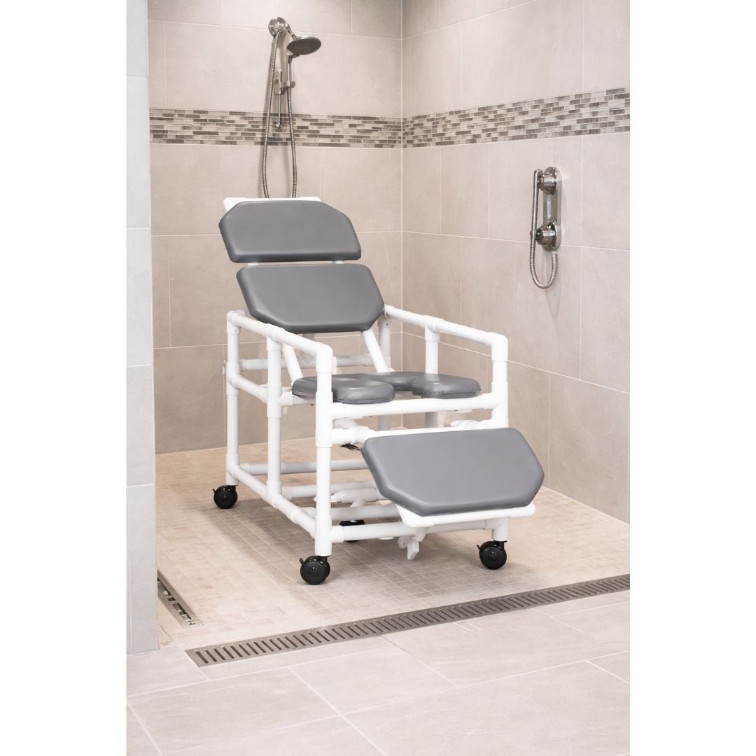 The IPU Reclining Shower Chair – Adjustable Recline & Padded Seating offers safe, cushioned support in a tiled walk-in shower featuring a handheld showerhead and PVC frame.