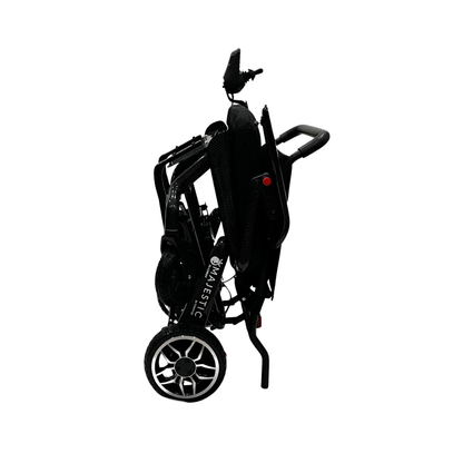 A ComfyGo IQ-Carbon Lightweight Carbon Fiber Electric Wheelchair, black, foldable and compact with visible wheels and extended handlebars, is shown upright on a white background.