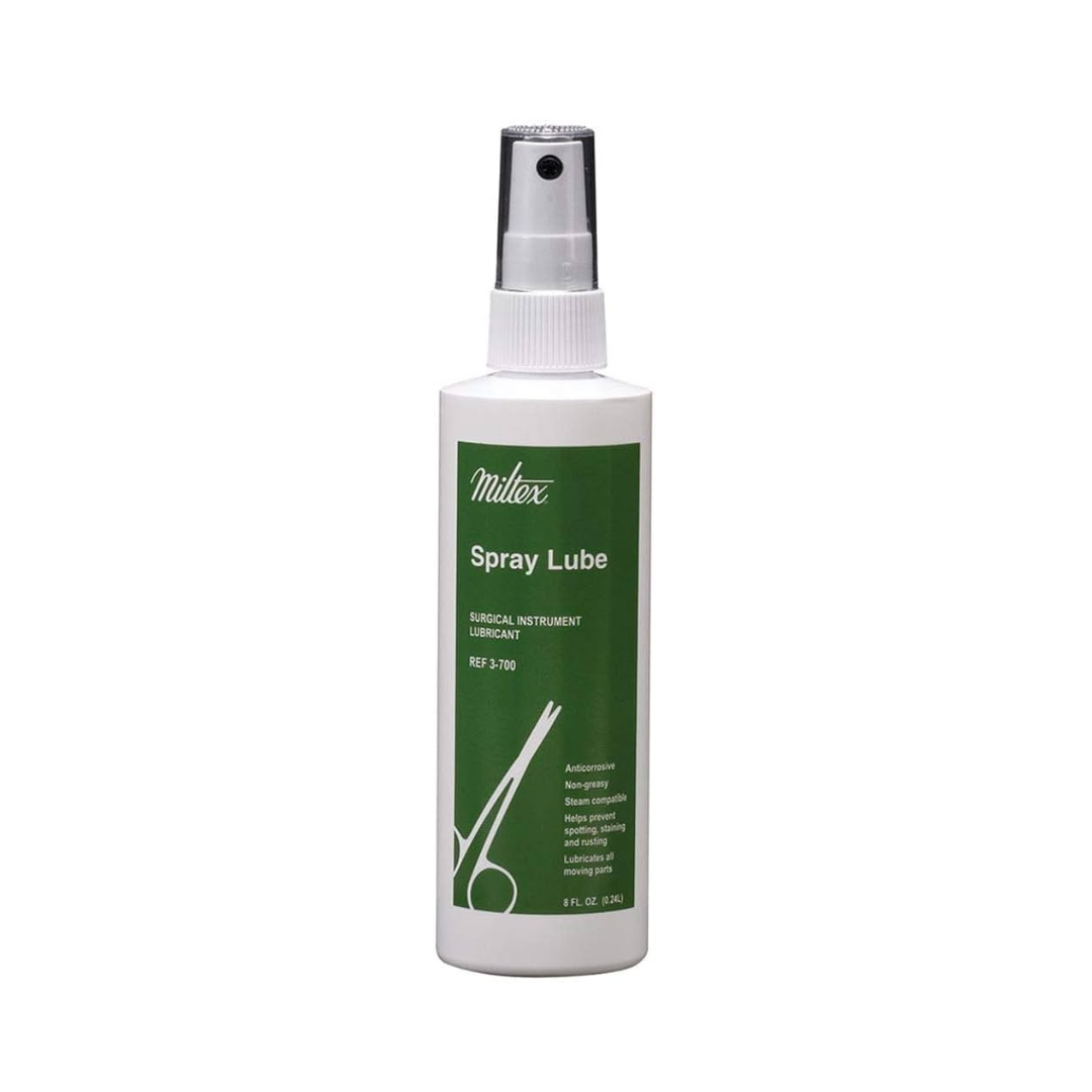 A white spray bottle labeled Integra B2n Instrument Lubricant with a green label, surgical scissors graphic, black spray nozzle, and white cap. This concentrated formula is ideal for surgical care instrument lubrication.