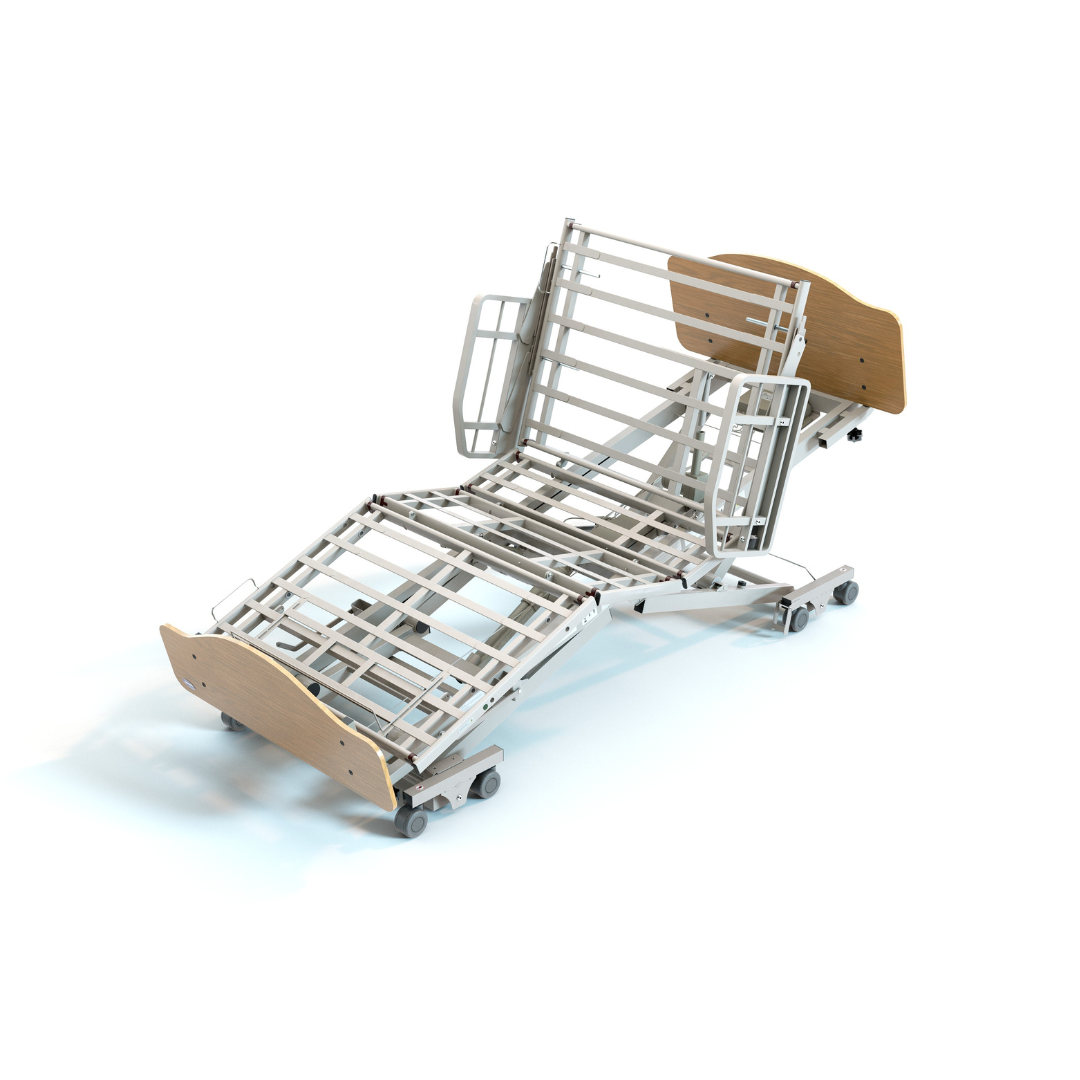An Invacare CS600™ Adjustable Long Term Care Bed | Expandable Width, featuring a modern hospital bed frame with metal slats, light wood head and footboards, and lockable wheels, isolated against a plain white background.