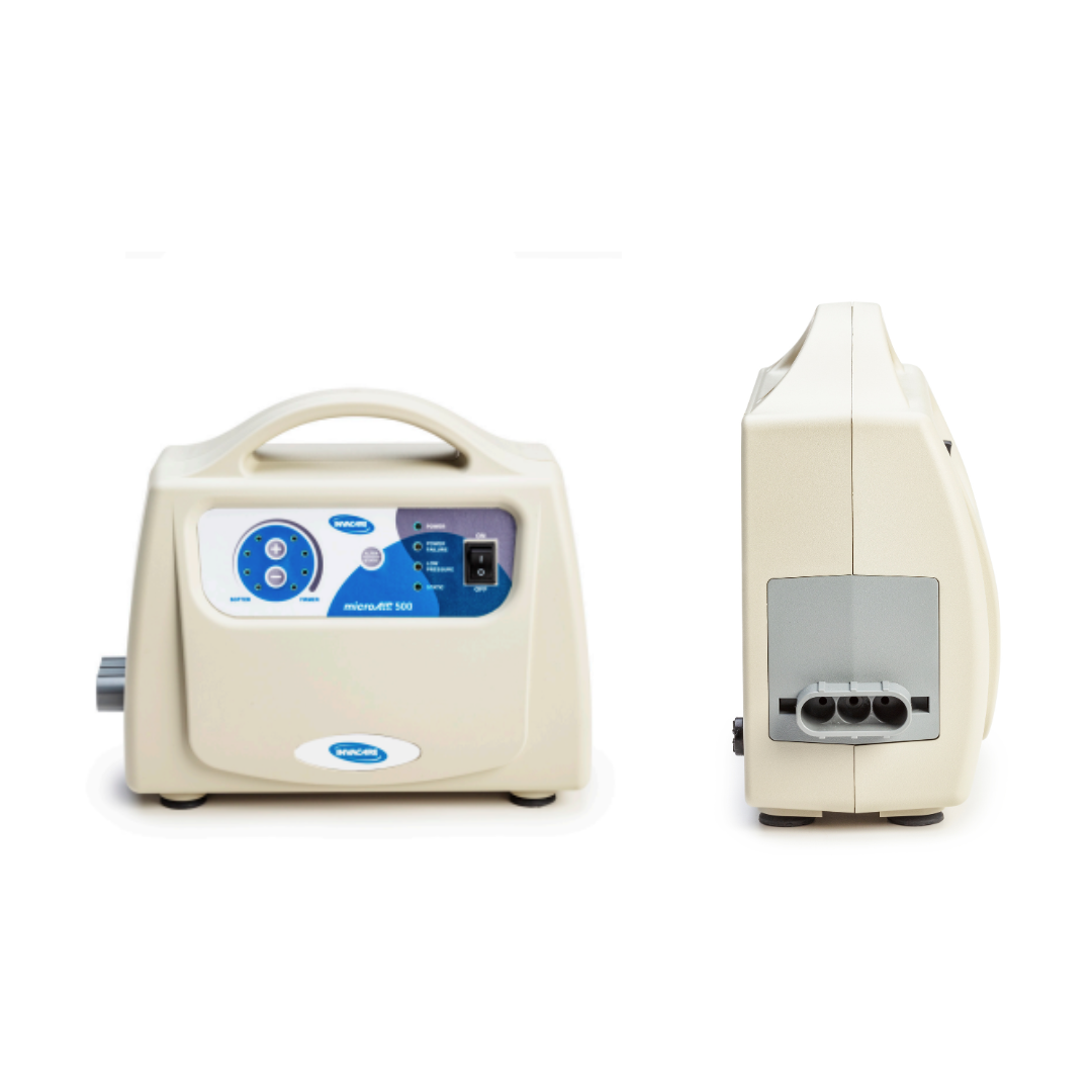 A beige Invacare microAIR® MA500 Alternating Pressure Low Air Loss Mattress System is shown from the front and side, featuring a control panel with buttons, a dial, display screen on the front, and side ports for optimal pressure relief.