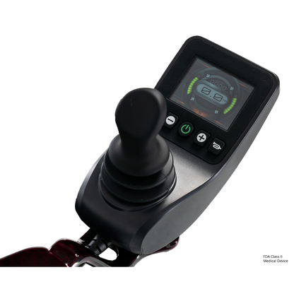 Close-up of the Pride Jazzy Carbon HD Bariatric Portable Powerchair’s black joystick controller, featuring a digital display for battery and speed, plus control buttons—designed for this lightweight travel power chair.