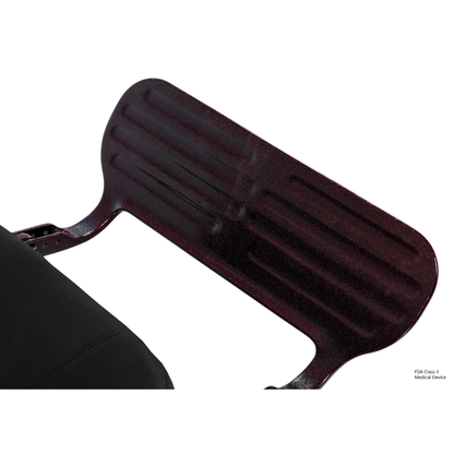 Close-up of a dark, textured metal footrest on the Pride Jazzy Carbon HD Bariatric Portable Powerchair, with part of its black cushioned seat visible on the left.