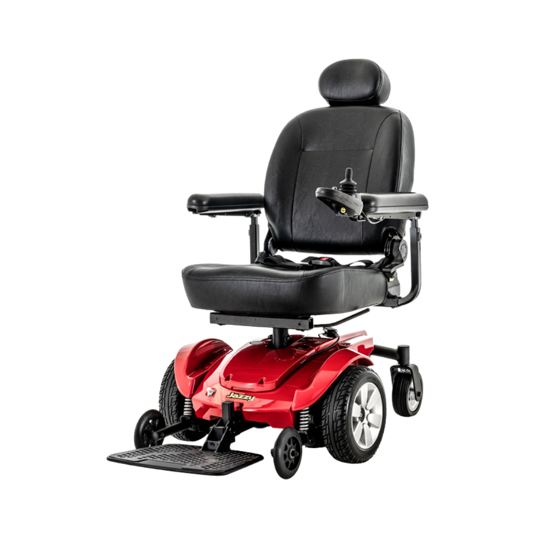A red Pride Mobility Jazzy Select® Powerchair with mid-wheel drive features a black cushioned seat, headrest, armrests, and right-side joystick control, displayed against a white background.