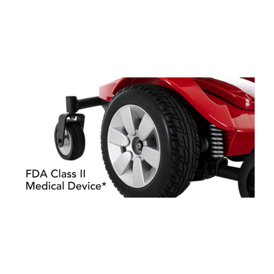 Close-up of the Pride Mobility Jazzy Select® Powerchair's rear wheel and suspension, featuring the text "FDA Class II Medical Device*" on the left side of the image.