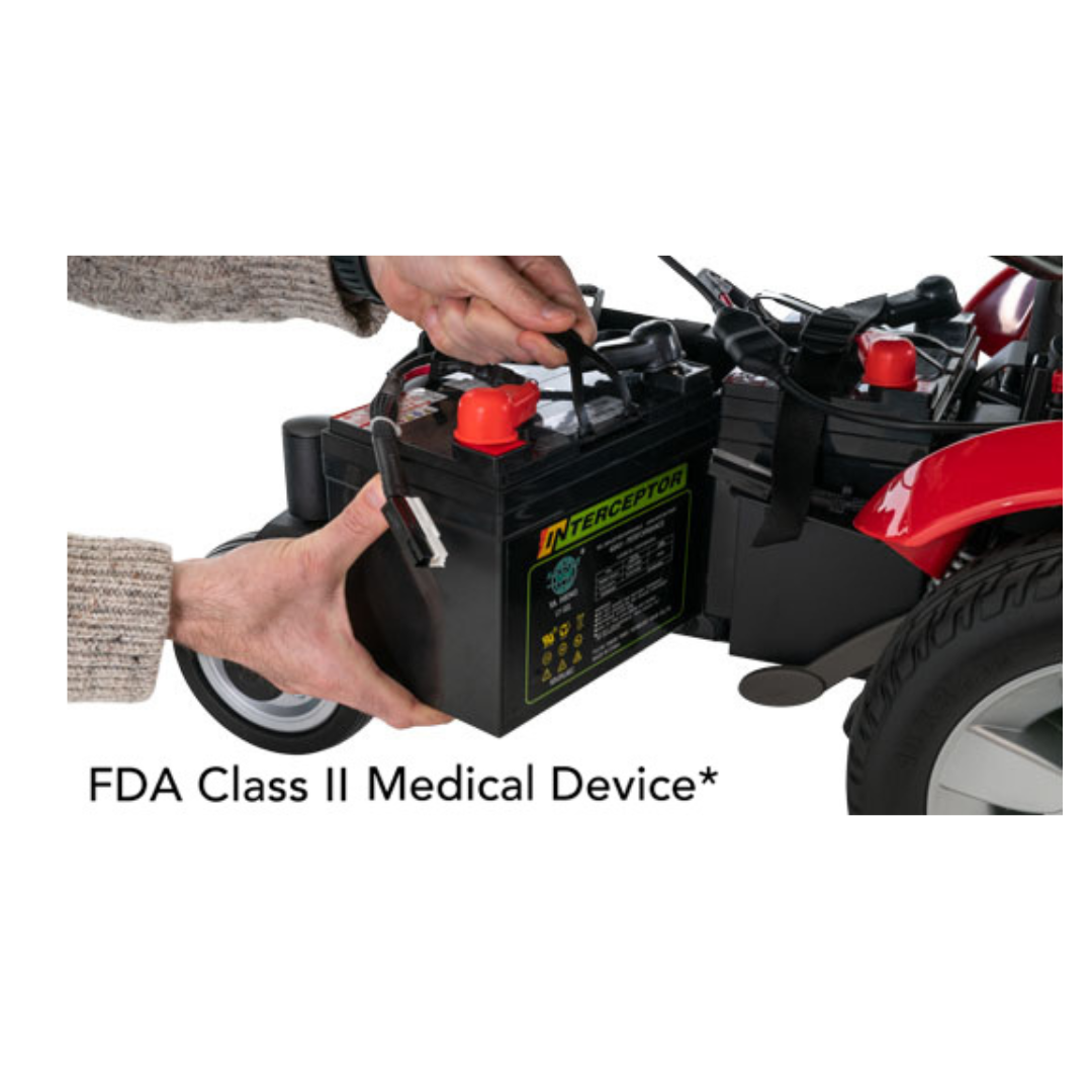A person removes a large battery from a Pride Mobility Jazzy Select® Powerchair. Text below reads “FDA Class II Medical Device*”.