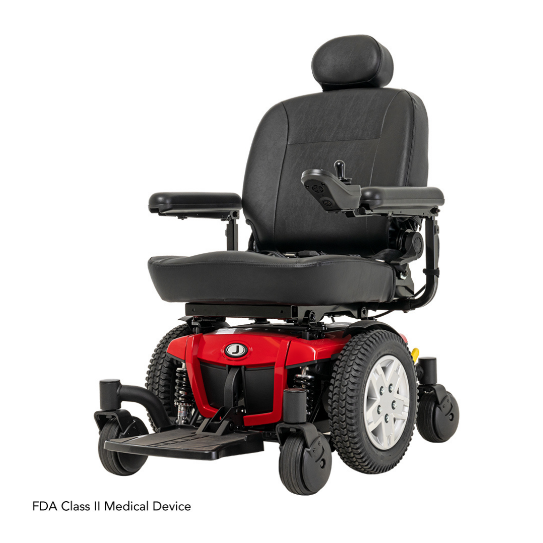A black and red Pride Mobility Jazzy® 600 ES Powerchair with ATX Suspension, padded seat, armrests, headrest, and large rear wheels. Viewed from the front right angle. Features Mid-Wheel 6® technology. FDA Class II Medical Device.