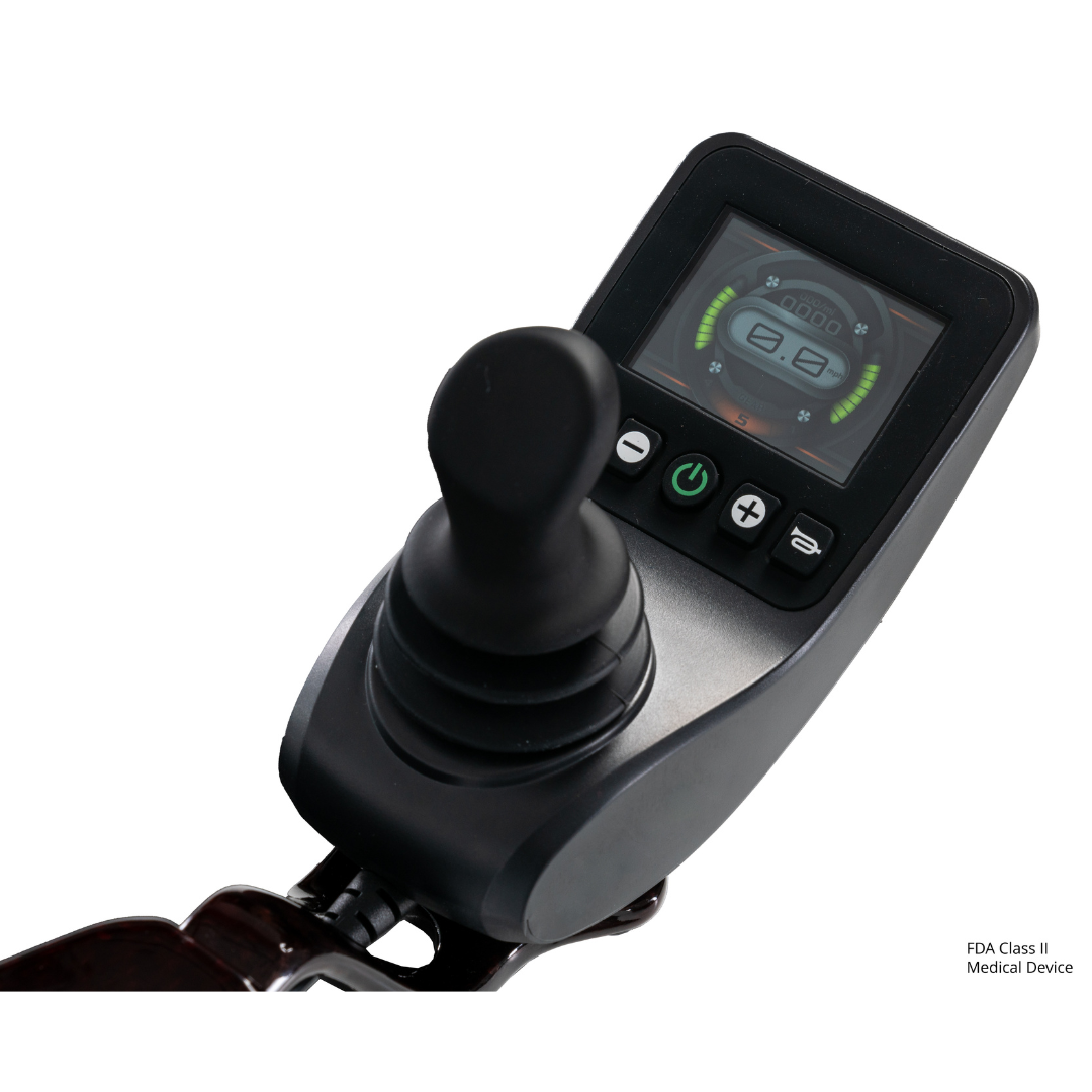 Close-up of a black electronic joystick controller with a display showing battery and speed indicators, designed for the Jazzy® Carbon 27 Ultralite Portable Power Wheelchair.