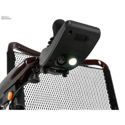 Close-up of the joystick controller attached to the armrest of the Jazzy® Carbon 27 Ultralite Portable Power Wheelchair, featuring a mesh seat back and an illuminated light beneath the controller.