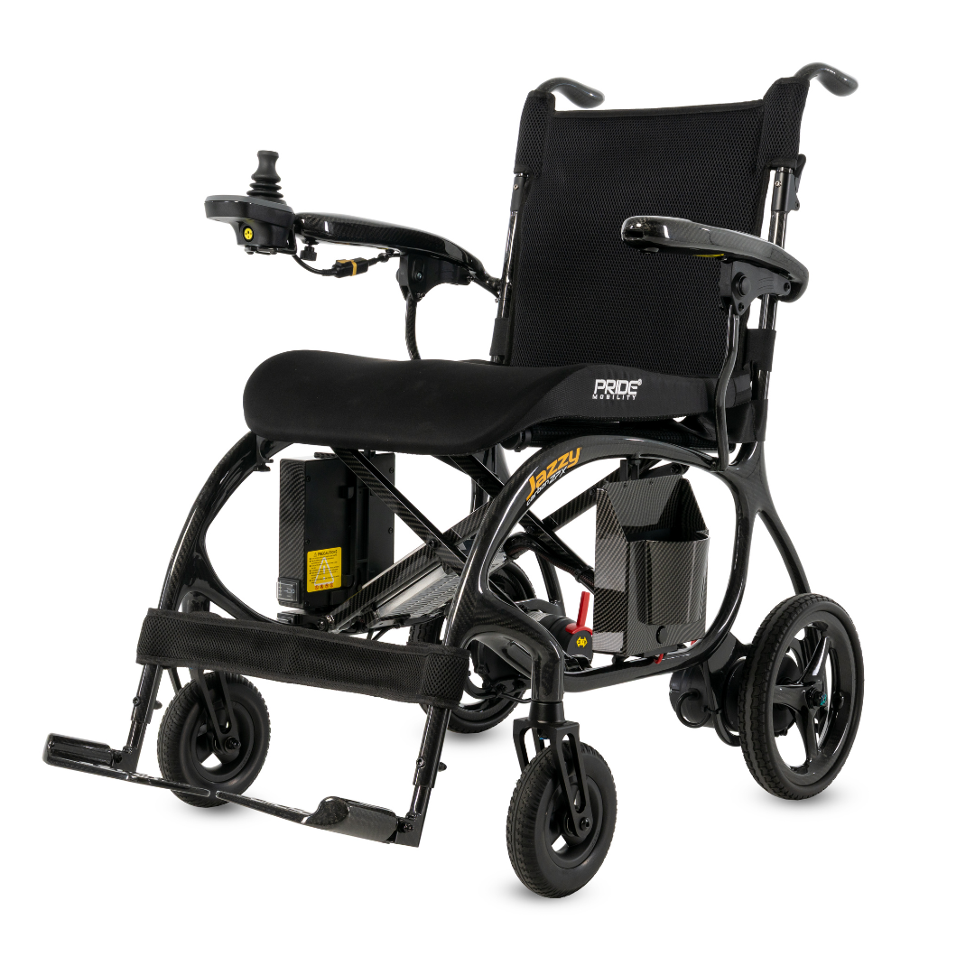 The Pride Jazzy® Carbon 27X Portable Power Wheelchair is a black, ultra-lightweight chair with a mesh backrest, right-arm joystick controller, footrests, and four wheels—ideal for travel. Pride and Jazzy branding decorate the frame.