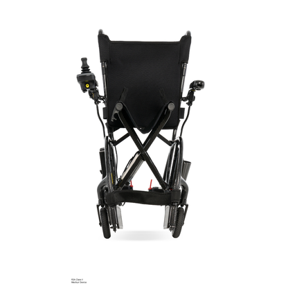 Rear view of the Pride Jazzy® Carbon 27X Portable Power Wheelchair, featuring a black ultra-lightweight frame, wheels, and a joystick control on the left armrest, set against a plain white background.