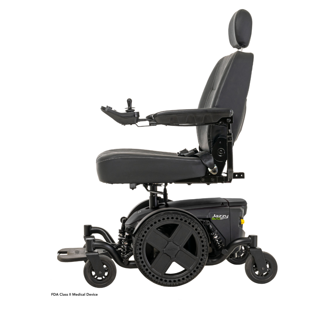 The Pride Mobility Jazzy® EVO 614 HD Bariatric Powerchair with ATX Suspension is shown in side profile on a white background. It features a black frame, cushioned seat, adjustable armrests, headrest, joystick control, and large rear wheels.