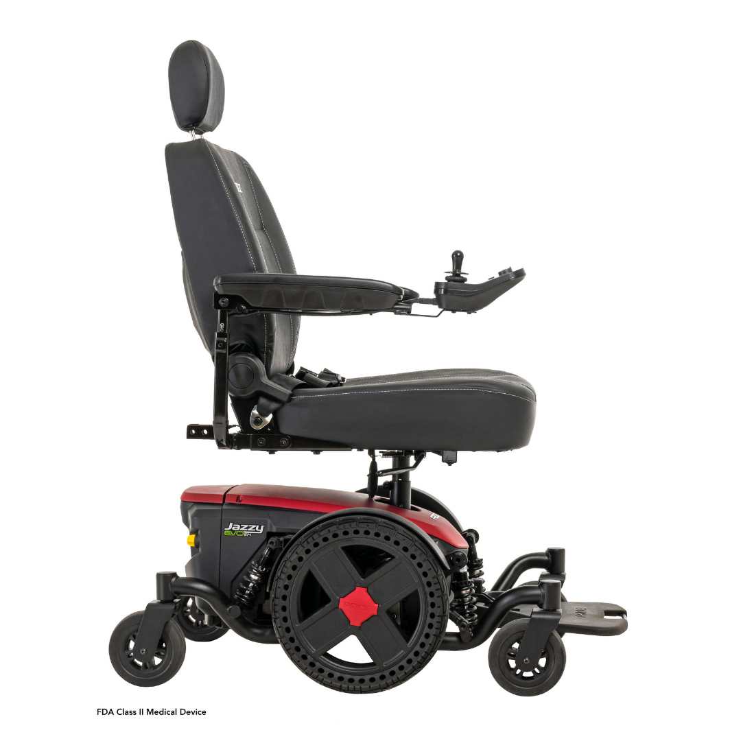 A side view of the Pride Mobility Jazzy® EVO 614 HD Bariatric Powerchair with ATX Suspension, in black and red, featuring a cushioned seat with headrest, armrests, right-side joystick control, and four heavy-duty wheels.