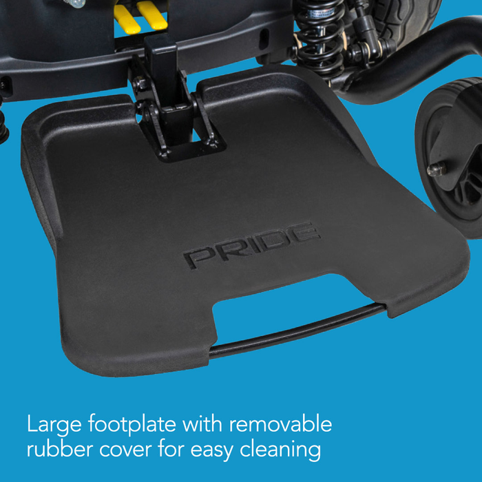 Close-up of the large black footplate with PRIDE embossed, attached to the Pride Mobility Jazzy® EVO 614 HD Bariatric Powerchair with ATX Suspension. Features include a removable rubber cover and text highlights easy cleaning on a blue background.