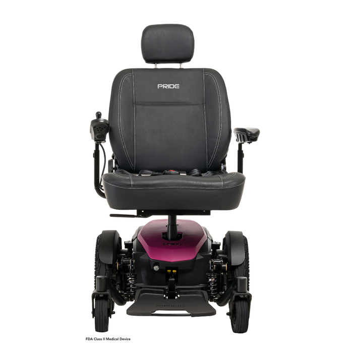 Front view of the Pride Mobility Jazzy® EVO 614 HD Bariatric Powerchair with ATX Suspension, magenta base, left-side joystick, armrests, Pride logo on headrest, and four wheels; a heavy-duty mobility chair.