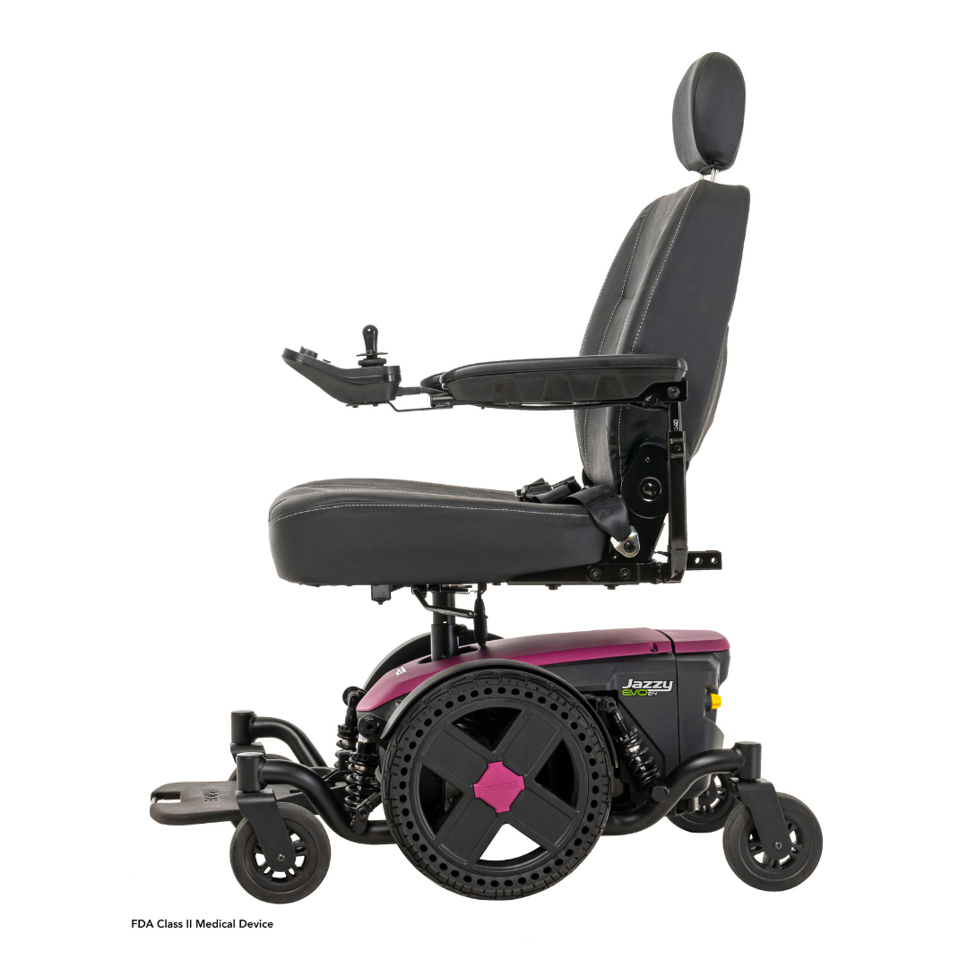 A side view of the Pride Mobility Jazzy® EVO 614 HD Bariatric Powerchair with ATX Suspension, featuring a black seat with headrest, armrests, and a purple base with large rear wheels and smaller front wheels for heavy-duty mobility.