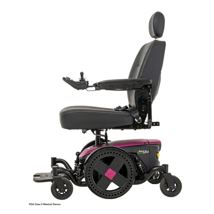 A side view of the Pride Mobility Jazzy® EVO 614 HD Bariatric Powerchair with ATX Suspension, featuring a black seat with headrest, armrests, and a purple base with large rear wheels and smaller front wheels for heavy-duty mobility.