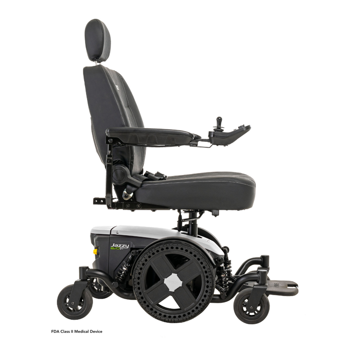 The Pride Mobility Jazzy® EVO 614 HD Bariatric Powerchair with ATX Suspension features a cushioned seat, adjustable headrest, armrests, footrest, right-side joystick, and a heavy-duty mobility base for smooth travel.