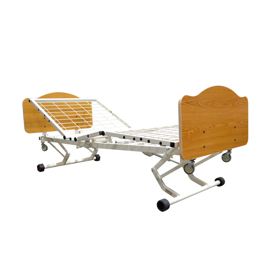 The Joerns WeCare® Full-Electric Hi/Low Bariatric Homecare Bed features a metal frame, adjustable sections, wooden head and footboards, lockable wheels for mobility, and an ultra-low height design to help prevent falls.