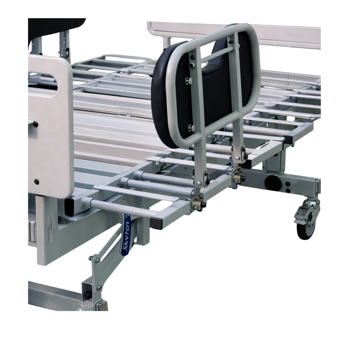 A close-up view of Joerns Accessories for RC 1000 Bariatric Bed features metal rails, adjustable sections, and a padded black side rail, highlighting bariatric patient support and enhanced mobility through the exposed mechanical structure.