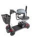 The Journey Adventure Scooter is a 4-wheel portable mobility scooter featuring black seat and handlebars, a front basket, red base accents, and is suitable for indoor/outdoor use with intuitive controls.