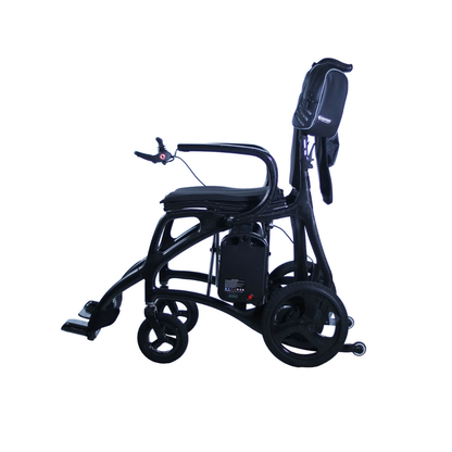 The Journey Air Elite Max Ultralite Carbon Fiber Travel Powerchair features a lightweight curved frame, padded seat, footrest, and a small carry bag attached at the back, displayed against a white background.