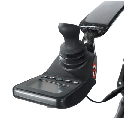 Close-up of a black joystick controller with display screen, buttons, and curved handgrip on the Journey Air Elite Max Ultralite Carbon Fiber Travel Powerchair—perfect for comfortable wheelchair or mobility chair use.