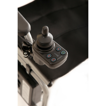 Close-up of the joystick control panel on the travel-friendly Journey Air Elite Folding Carbon Fiber Powerchair, which weighs just 29 lbs. The panel includes multiple buttons and a joystick handle, set against a dark seat backdrop.