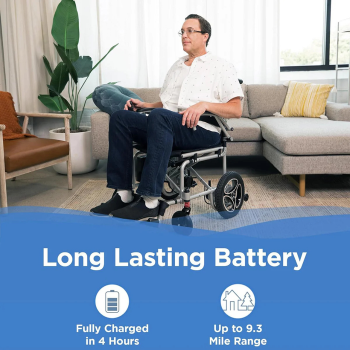 In a cozy living room, someone relaxes in their Journey Air Elite Folding Lightweight Powerchair, weighing just 29 lbs. Its standout battery features include Fully Charged in 4 Hours and Up to 9.3 Mile Range. A couch and plants enhance the inviting scene, ideal for seamless indoor navigation.