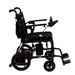 Side view of the Journey Air Elite Folding Lightweight Powerchair, a black electric wheelchair weighing only 29 lbs, featuring joystick control on the armrest, anti-tip wheels, and foldable footrests for seamless mobility assistance and smooth indoor navigation.