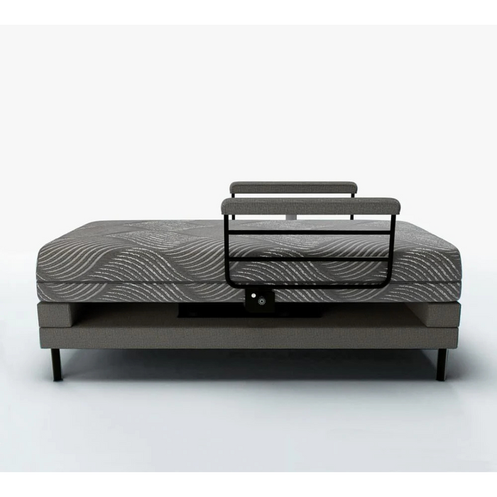 Introducing the Journey UPbed® Independence: a 4-in-1 motorized lift bed with 90° rotation. Featuring a gray wave-patterned memory foam mattress and sleek black metal rails, its displayed raised against a white background, highlighting its contemporary design.