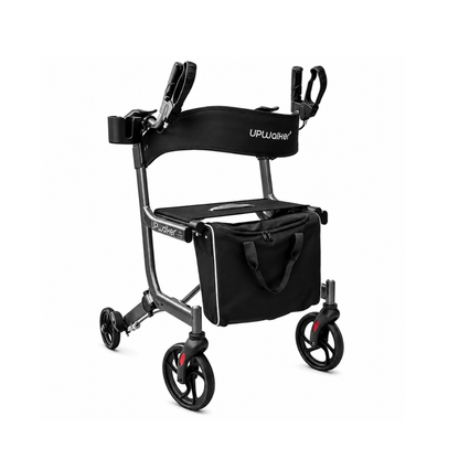 The Journey UPWalker® EZ Lite Rollator, an upright rolling walker in black with four wheels, a seat, padded armrests, hand grips, and a detachable front storage bag is shown against a plain white background.