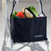 A black luxury personal bag filled with fresh vegetables like bell peppers and leafy greens is attached to a silver walker. The bag prominently displays Journey UPWalker Parts & Accessories in white text, making it a stylish walker accessory.