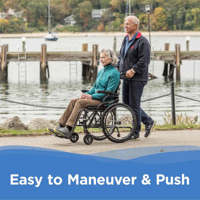 An elderly man pushes a smiling woman in the Journey So Lite® C2 Ultra Lightweight Wheelchair along a scenic waterfront path with a pier, water, and trees. Text reads, Unmatched Mobility & Easy to Maneuver.