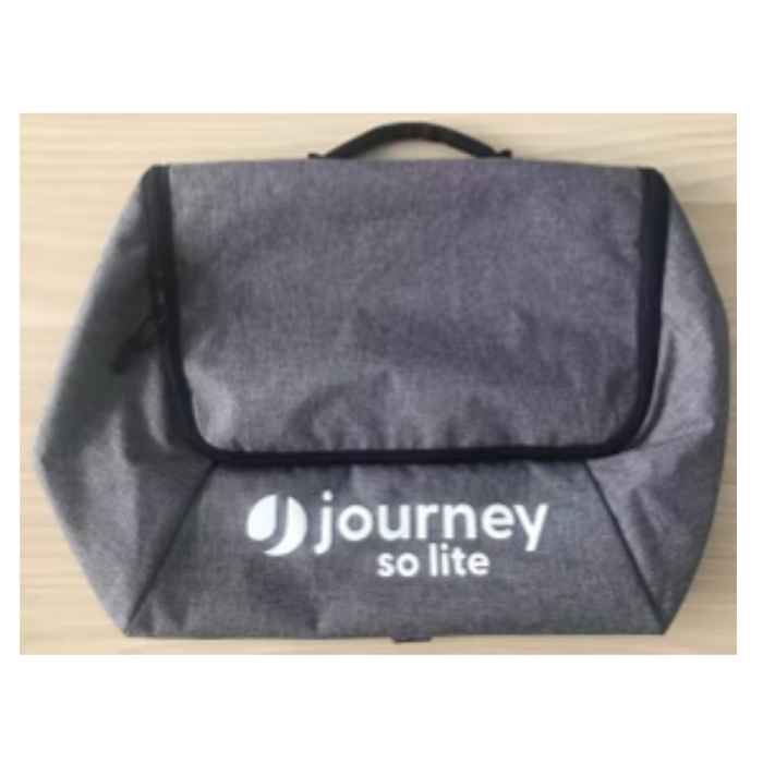 The Journey So Lite Scooter Parts & Accessories bag, with journey so lite in white on the front, features a handle and black zipper. Its gray design is laid flat on light wood, perfect for carrying essentials during your adventure.