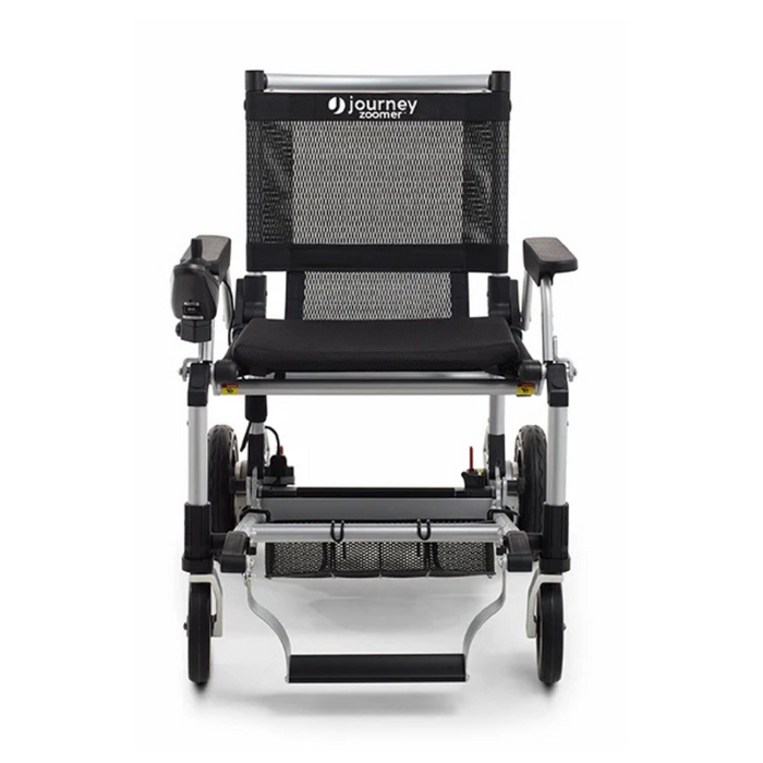 The Journey Zoomer® Portable Travel Powerchair features an innovative design for easy mobility. It includes a lightweight, folding silver frame with a black mesh seat and backrest, footrest, and a left armrest control panel. This FAA-approved model is ideal for convenient transport.