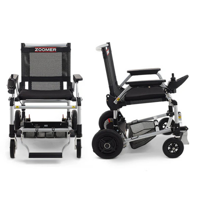 Two views of the Journey Zoomer® Portable Travel Powerchair in black and silver highlight its innovative design—front and side. This compact, folding electric wheelchair features sturdy wheels and an armrest joystick. ZOOMER is visible on the backrest. FAA Approved for travel use.